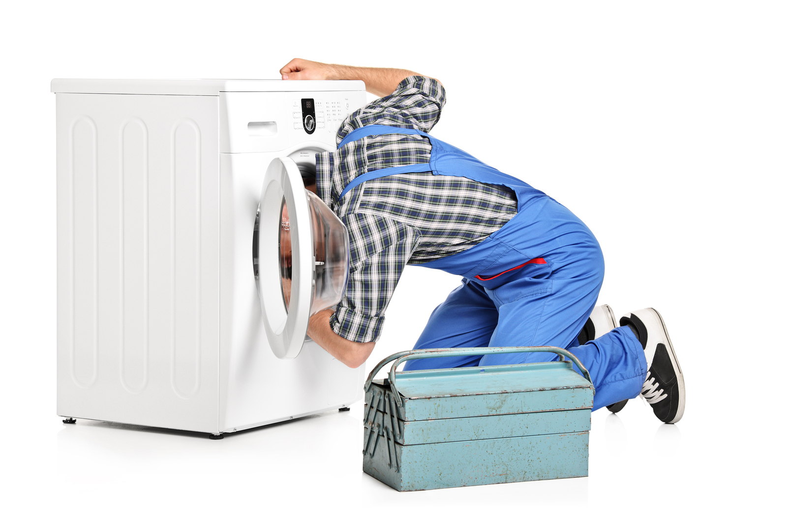 A repairman trying to fix a washing machine isolated on white ba